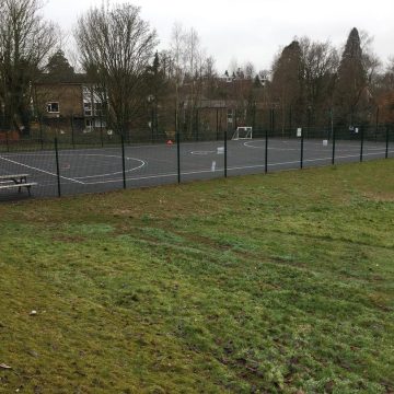 MUGA and concrete steps to a school in Haywards Heath