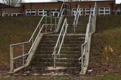 MUGA and concrete steps to a school in Haywards Heath