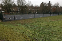 MUGA and concrete steps to a school in Haywards Heath