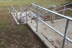 MUGA and concrete steps to a school in Haywards Heath